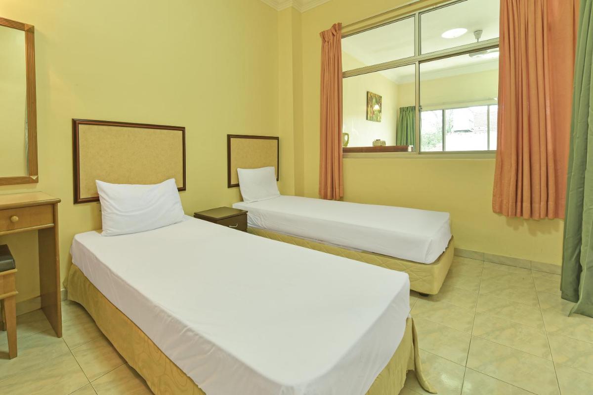 Suitetrails - OYO HOME 90700 Teluk Batik Holiday Apartment