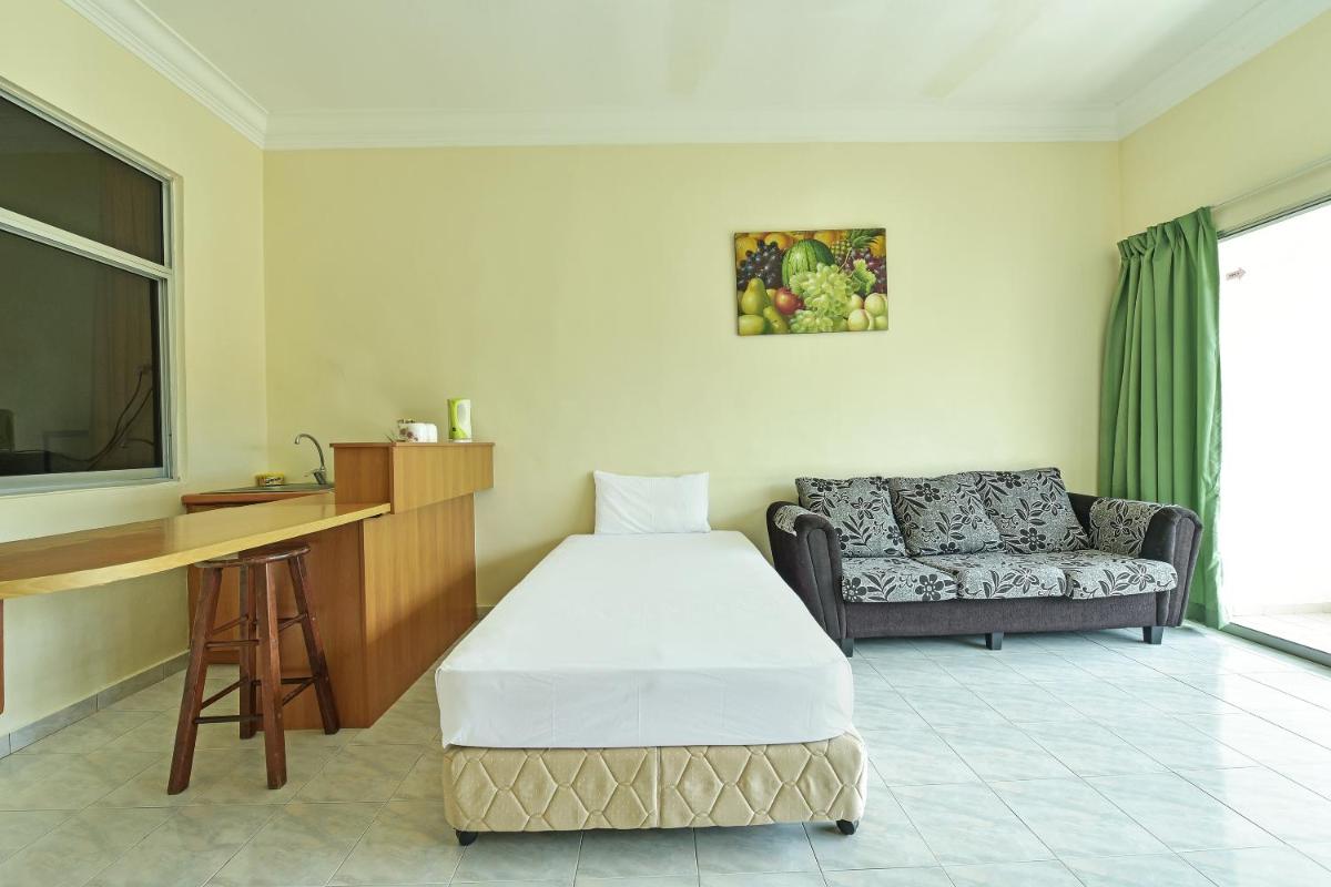 Suitetrails - OYO HOME 90700 Teluk Batik Holiday Apartment