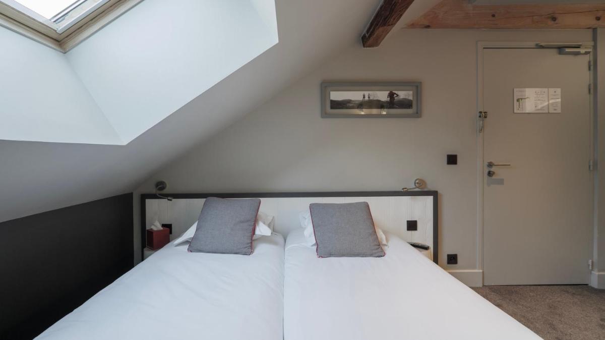 Un ou plusieurs lits dans un hébergement de l'établissement Le Faucigny - Hotel de Charme & SPA