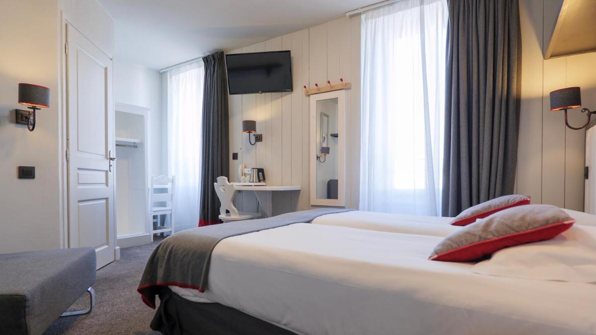 Un ou plusieurs lits dans un hébergement de l'établissement Le Faucigny - Hotel de Charme & SPA