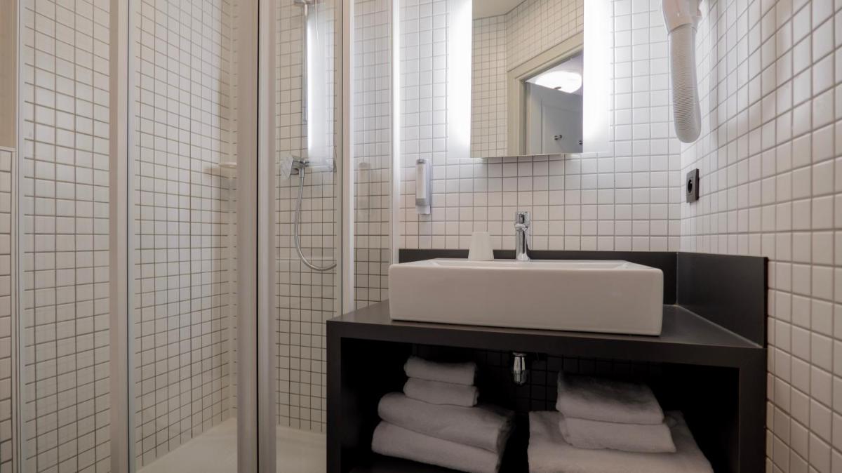 Salle de bains dans l'établissement Le Faucigny - Hotel de Charme & SPA