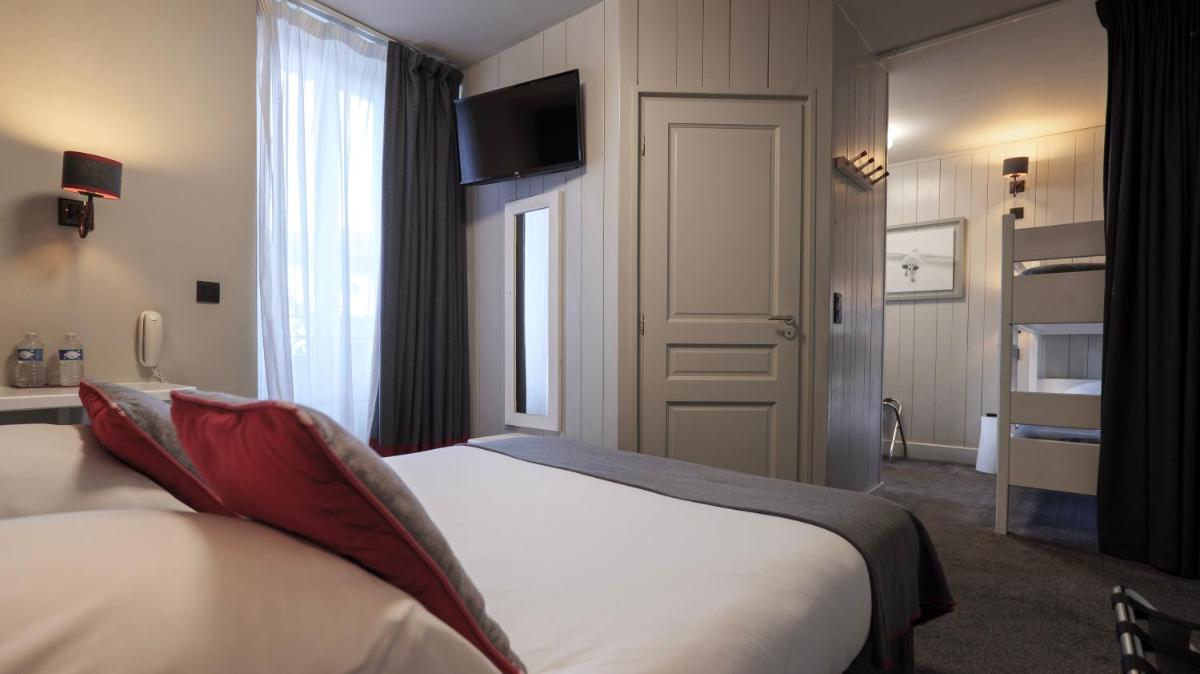 Un ou plusieurs lits dans un hébergement de l'établissement Le Faucigny - Hotel de Charme & SPA