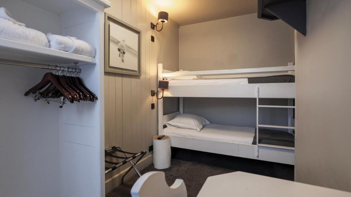 Un ou plusieurs lits dans un hébergement de l'établissement Le Faucigny - Hotel de Charme & SPA
