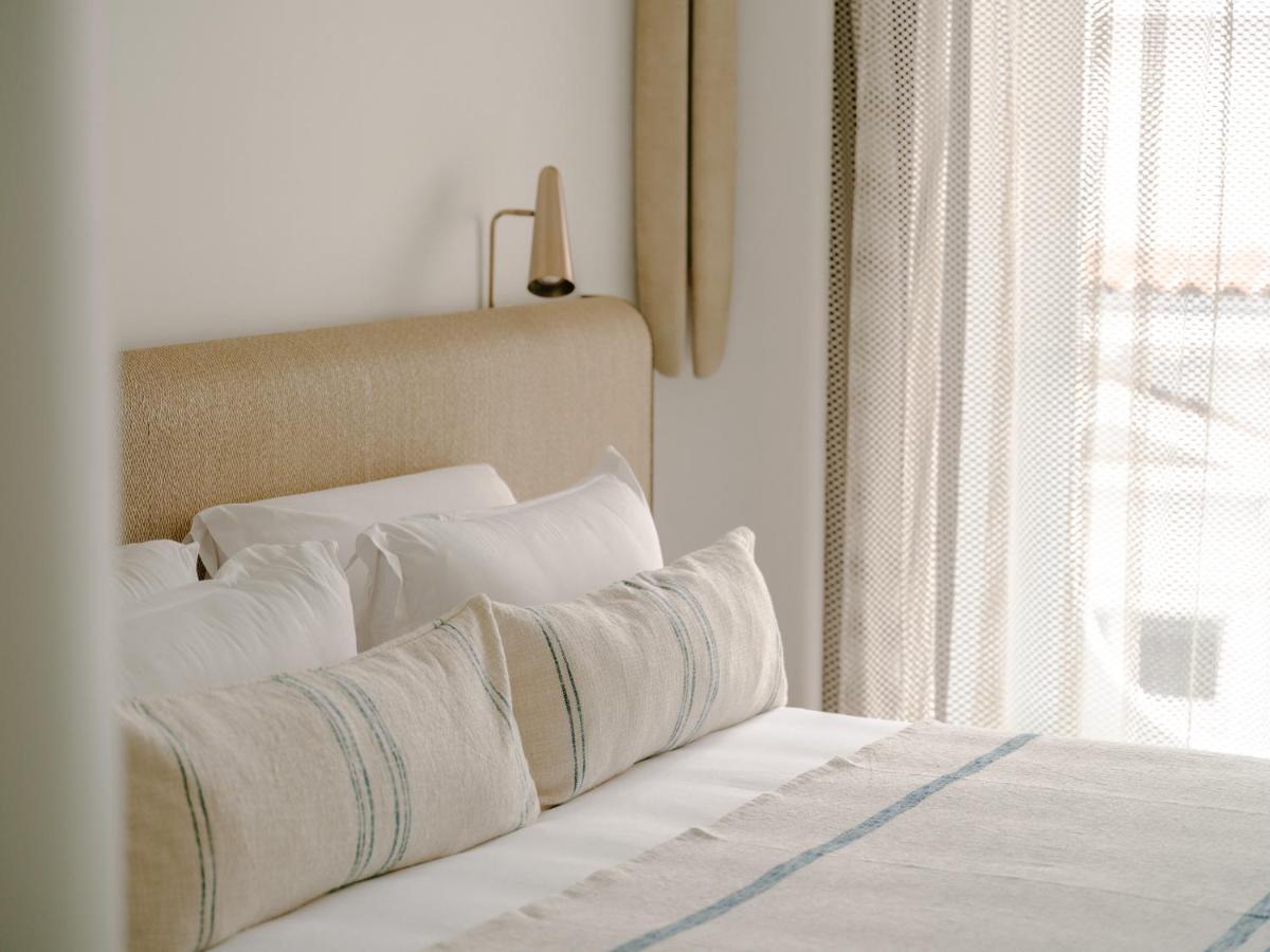 Un ou plusieurs lits dans un hébergement de l'établissement Hôtel & Spa Belle Plage