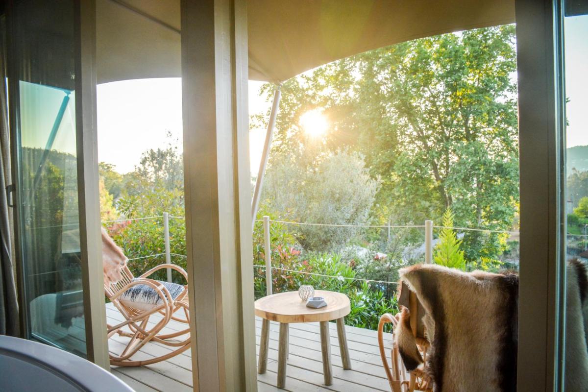 Um jardim no exterior de Carmo's Boutique Hotel - Small Luxury Hotels of the World