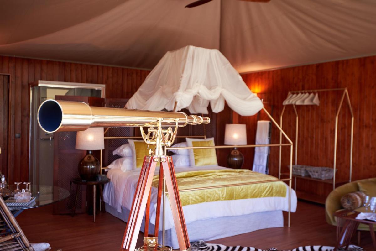 Uma cama ou camas num quarto em Carmo's Boutique Hotel - Small Luxury Hotels of the World