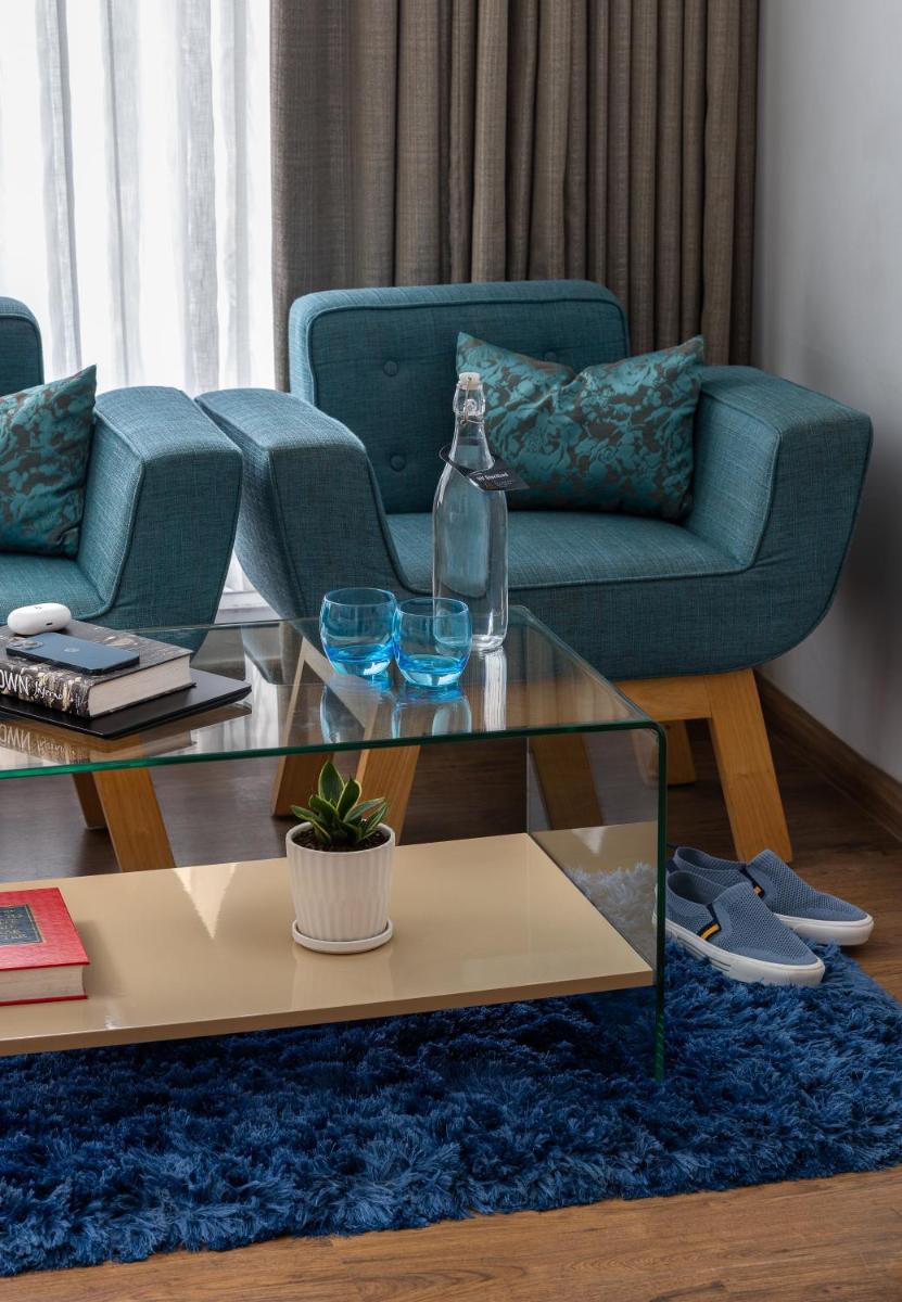 a living room with a couch and a coffee table at The Panoramic Getaway in Munnar