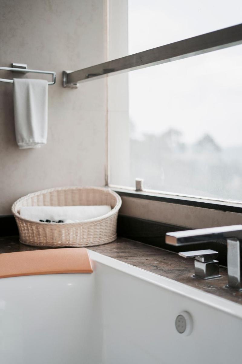 a bathroom with a sink and a mirror at The Panoramic Getaway in Munnar