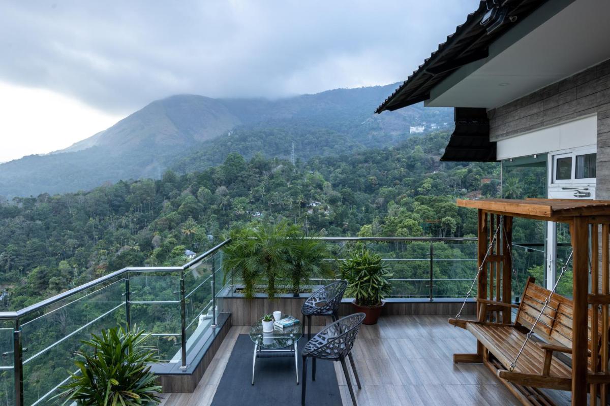 a balcony with a view of a mountain at The Panoramic Getaway in Munnar