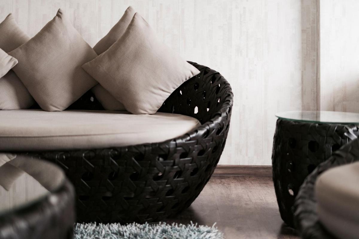 a living room with a couch with pillows on it at The Panoramic Getaway in Munnar