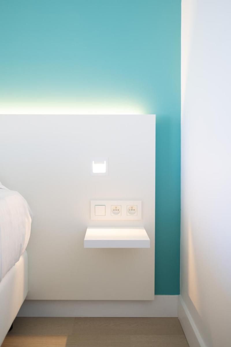 Un ou plusieurs lits dans un hébergement de l'établissement Hôtel Riva Art & Spa