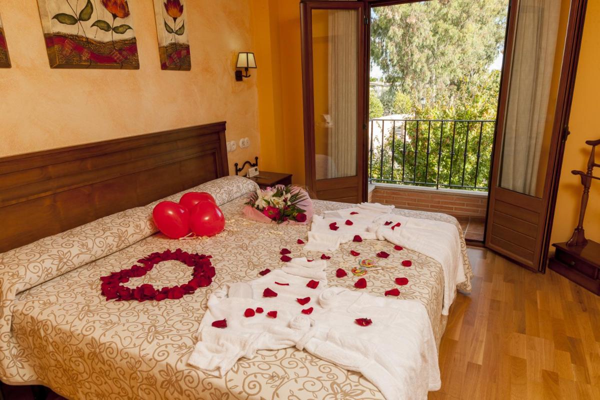 Cama o camas de una habitación en Hotel Comendador