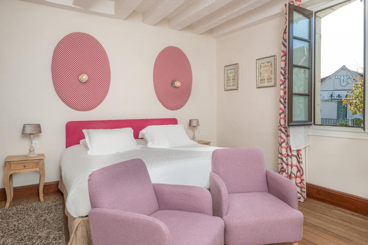 Un ou plusieurs lits dans un hébergement de l'établissement Auberge du Bon Laboureur Chenonceaux