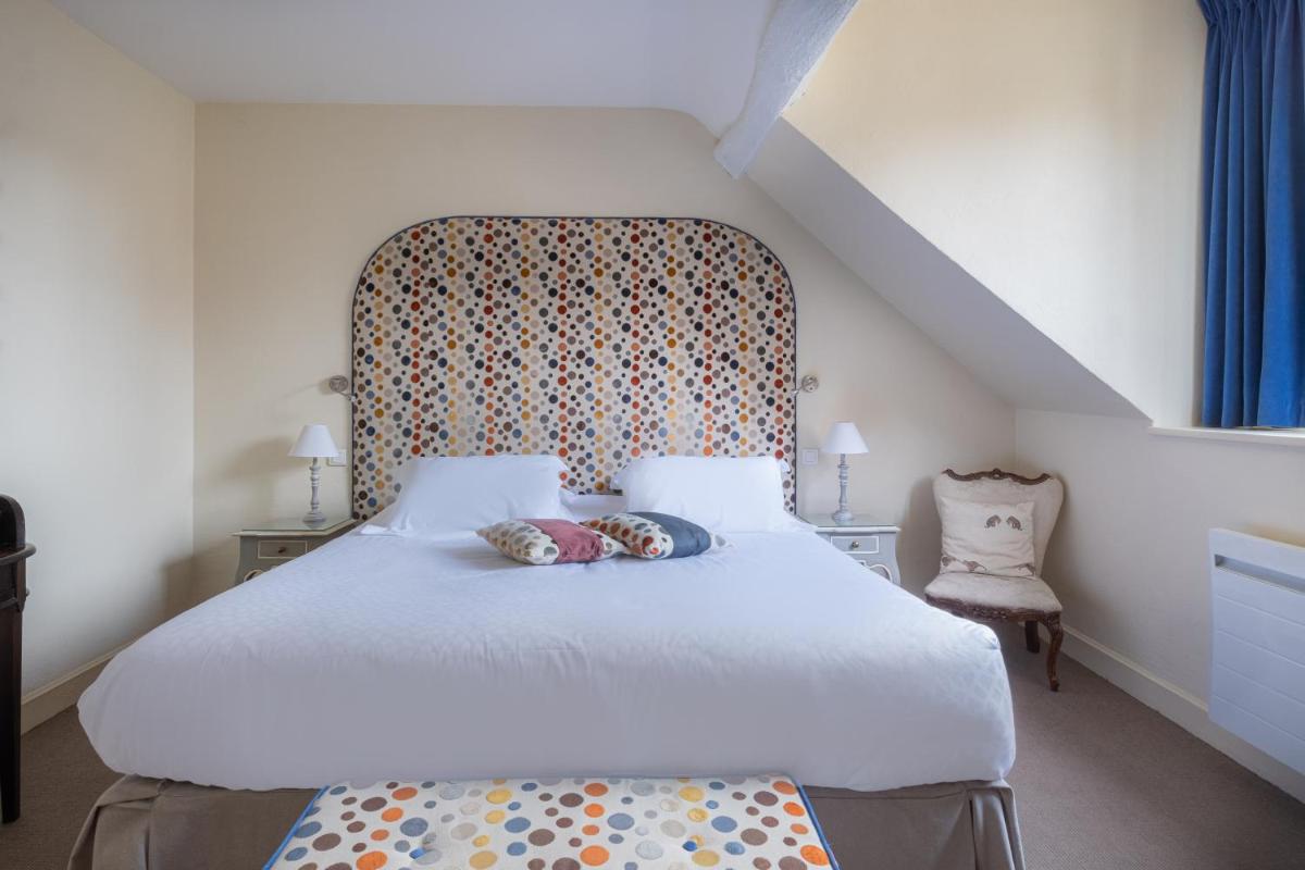 Un ou plusieurs lits dans un hébergement de l'établissement Auberge du Bon Laboureur Chenonceaux