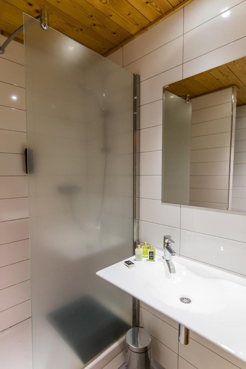 Salle de bains dans l'établissement Hôtel Le Cristal Lodge - TERRESENS