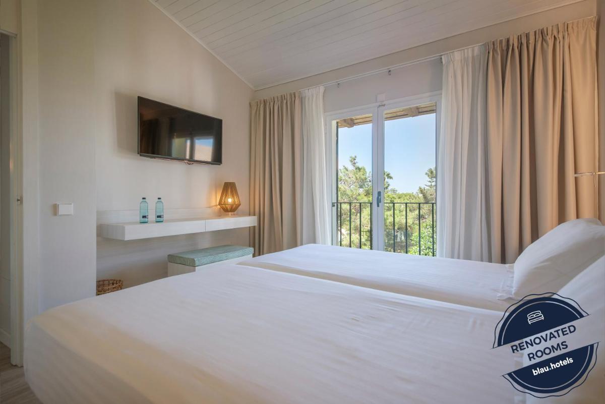 Cama o camas de una habitación en Blau Colònia Sant Jordi