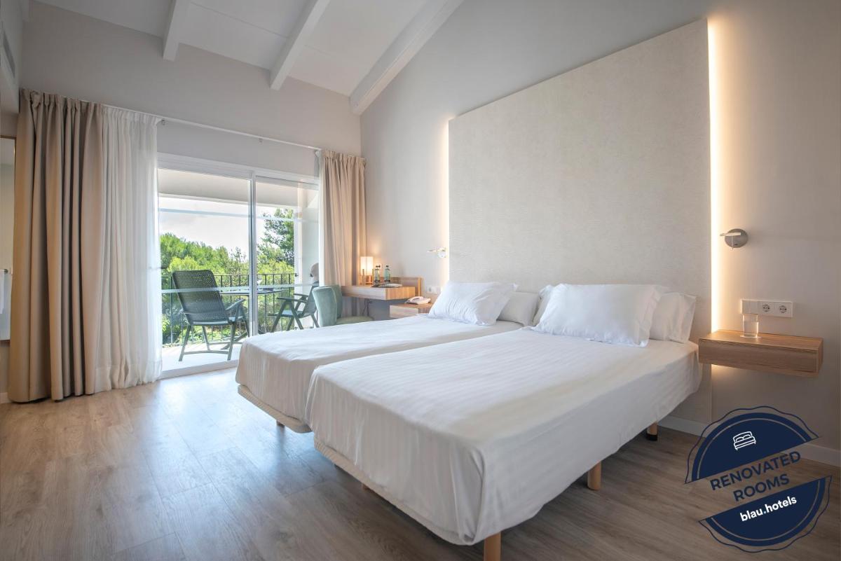 Cama o camas de una habitación en Blau Colònia Sant Jordi