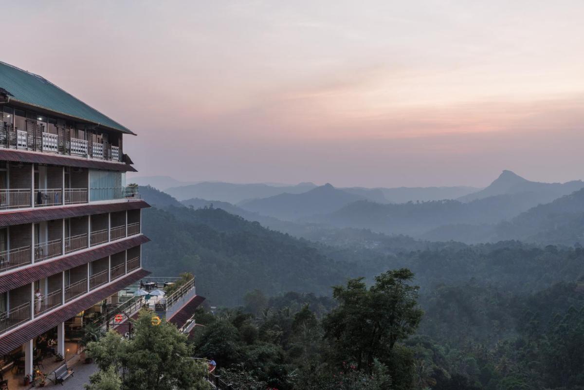 a building with a view of the mountains at The Panoramic Getaway in Munnar