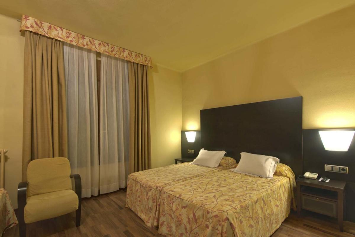 Cama o camas de una habitación en Hotel Restaurant Pessets & SPA