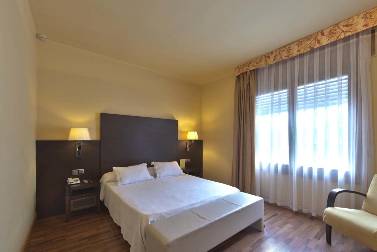 Cama o camas de una habitación en Hotel Restaurant Pessets & SPA