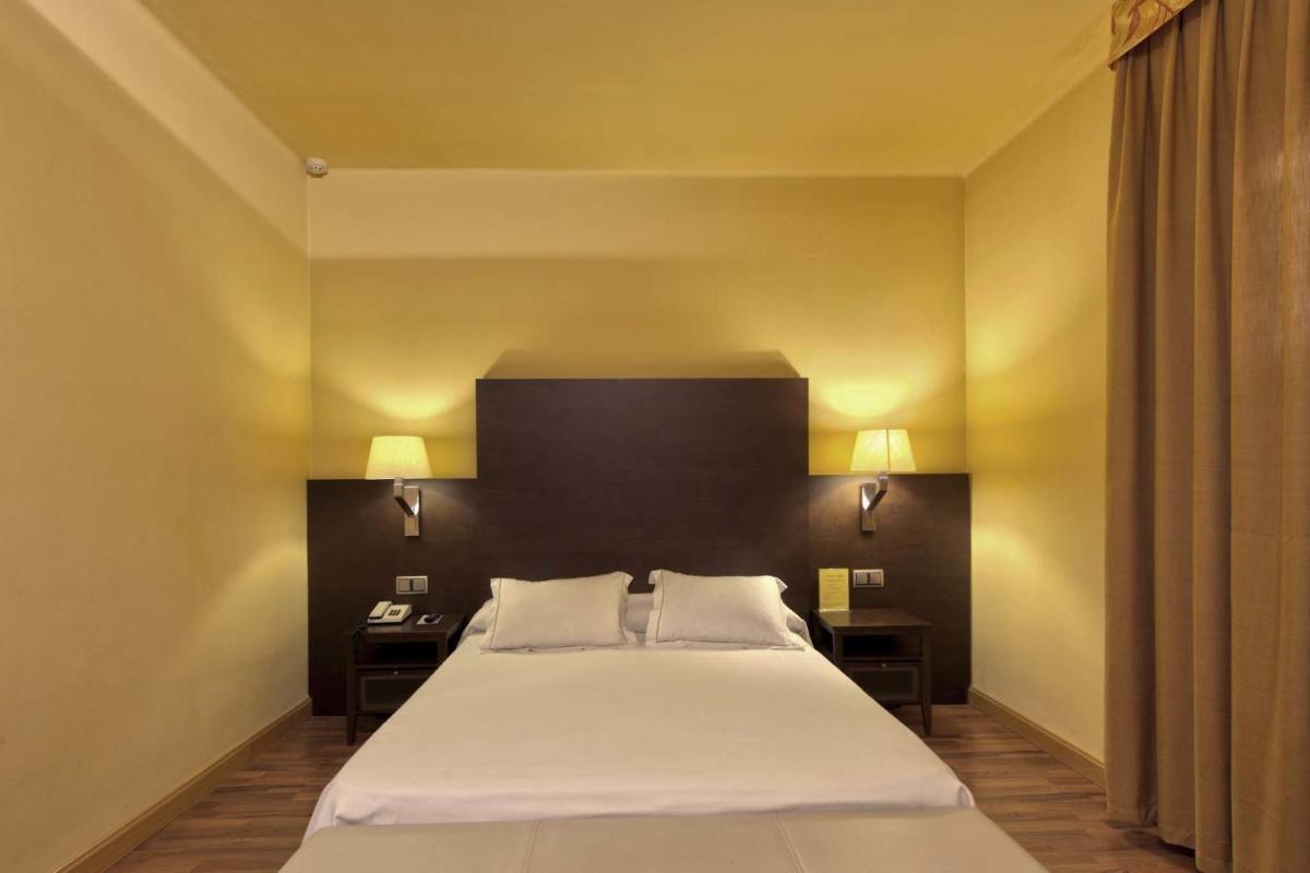 Cama o camas de una habitación en Hotel Restaurant Pessets & SPA