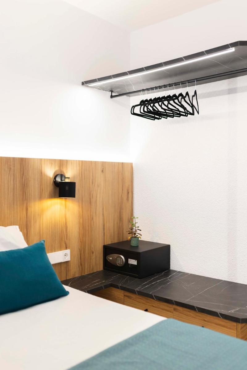 Cama o camas de una habitación en Alfons Hotel