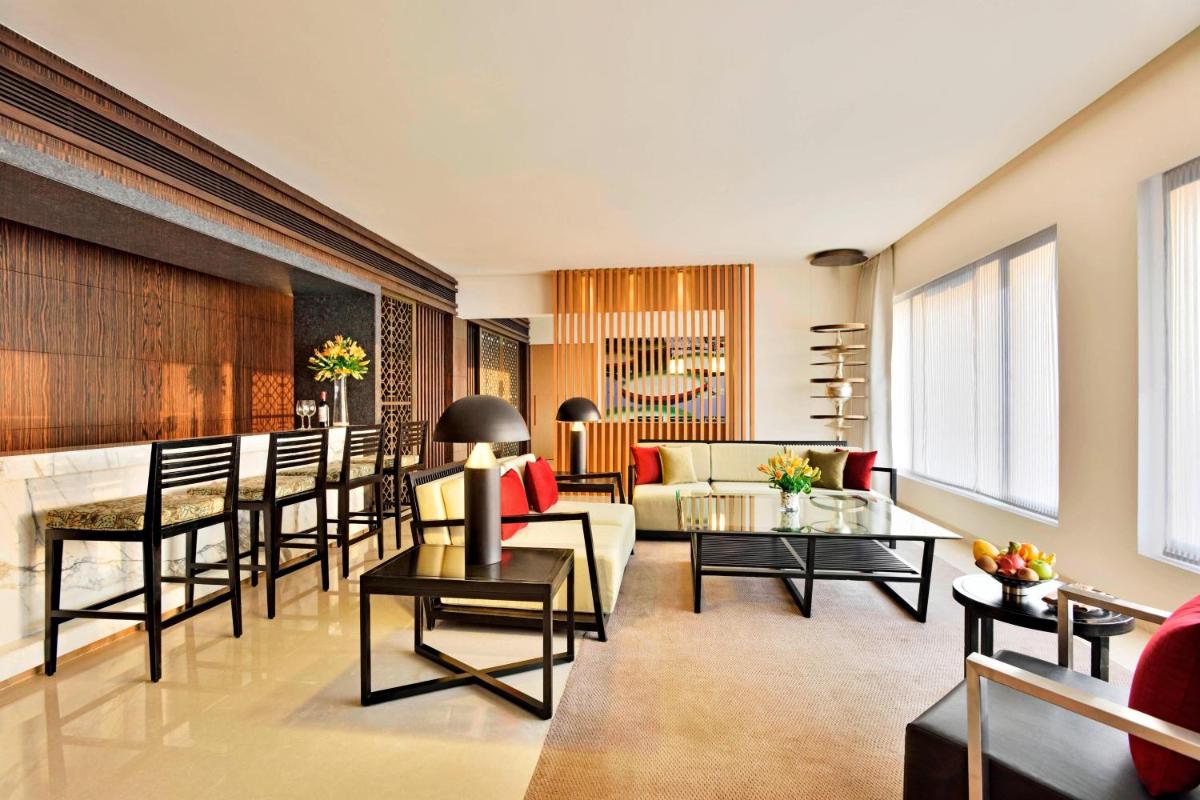 a living room with a couch and a table at The Westin Hyderabad Mindspace in Hyderabad