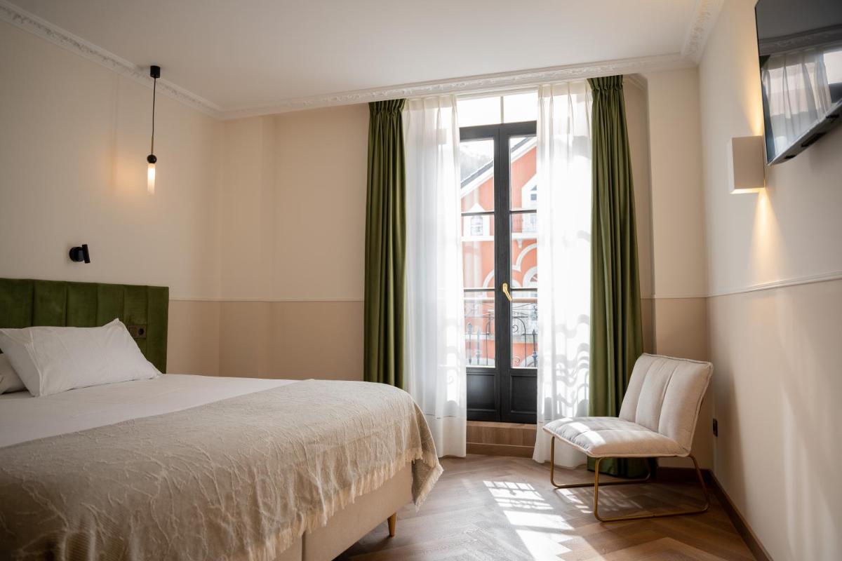 Cama o camas de una habitación en Hotel Boutique Las Indianas