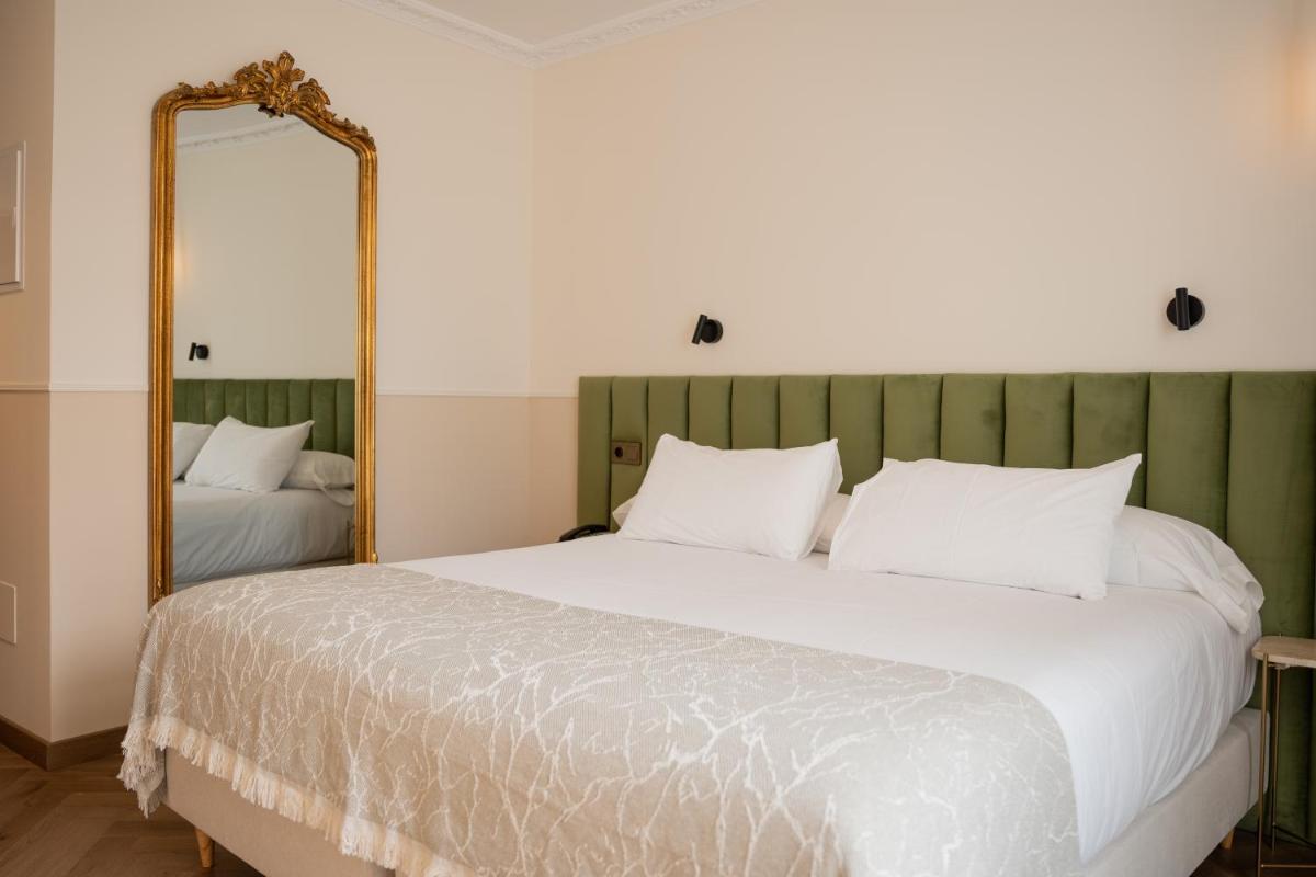 Cama o camas de una habitación en Hotel Boutique Las Indianas