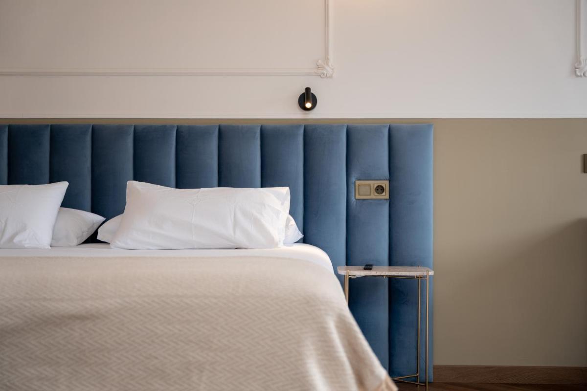 Cama o camas de una habitación en Hotel Boutique Las Indianas