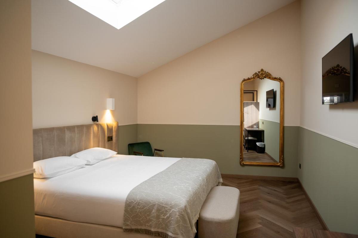 Cama o camas de una habitación en Hotel Boutique Las Indianas