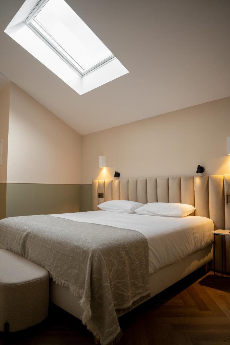 Cama o camas de una habitación en Hotel Boutique Las Indianas