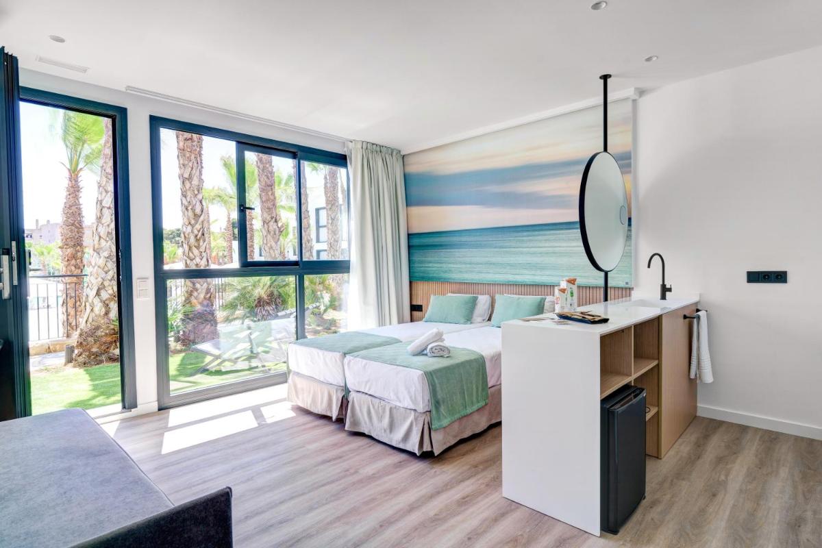 Cama o camas de una habitación en Alannia Salou