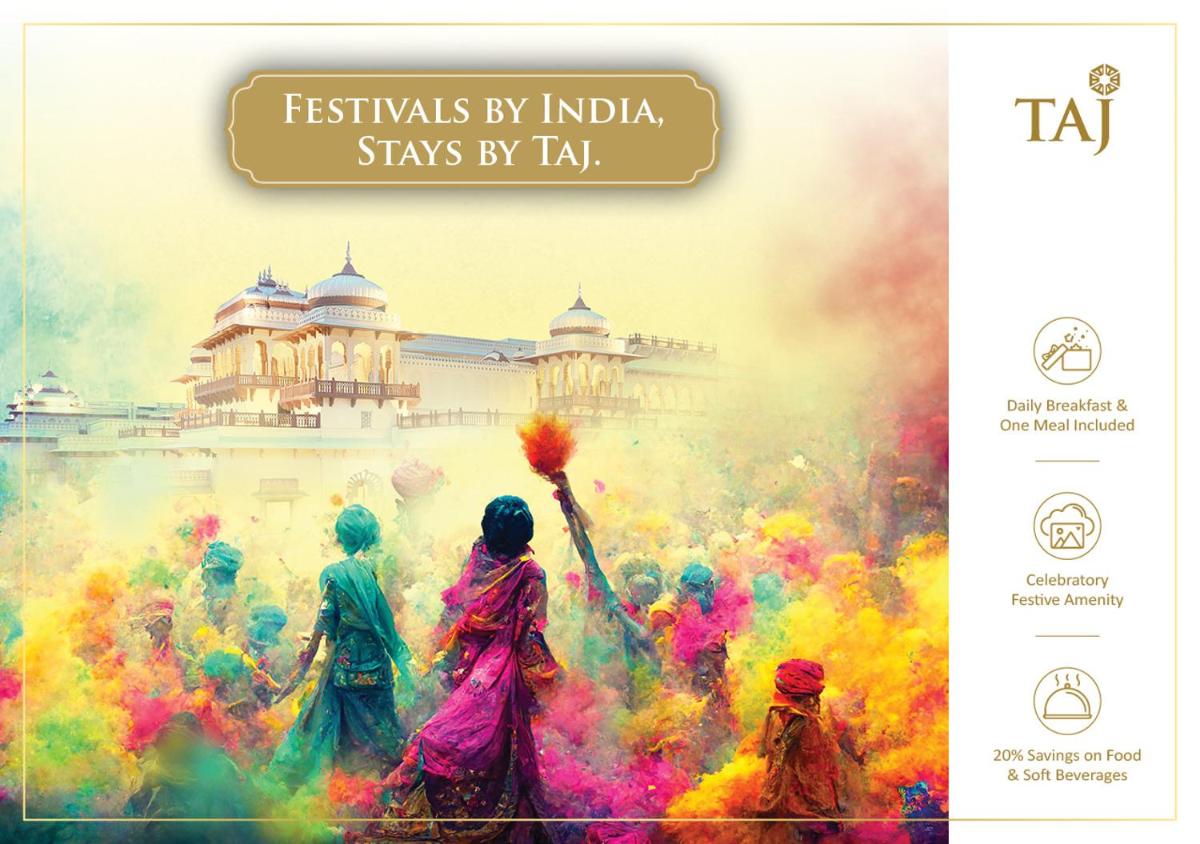 a group of people playing in the holi paint at Taj Tirupati in Tirupati