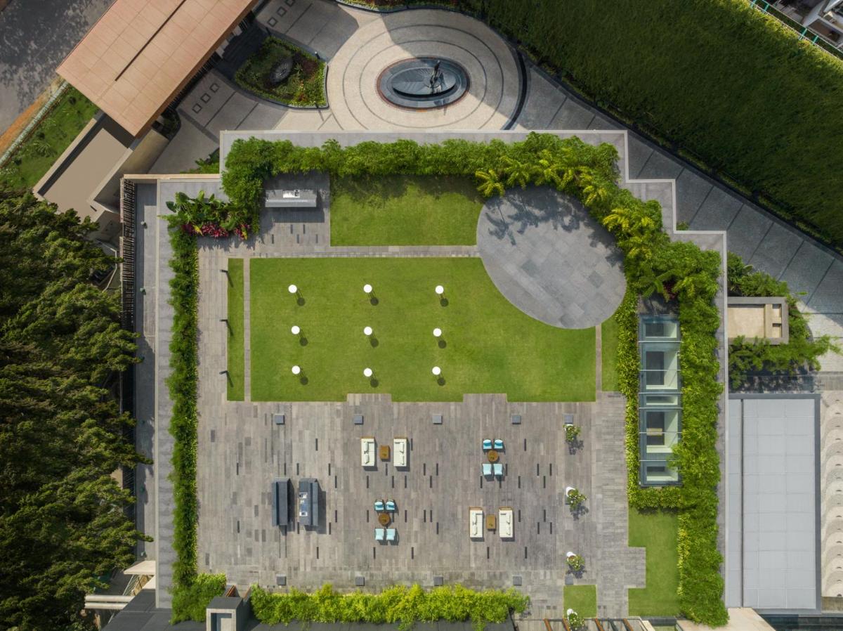 an overhead view of a garden with a park at JW Marriott Goa in Vagator an overhead view of a garden with a park at JW Marriott Goa in Vagator