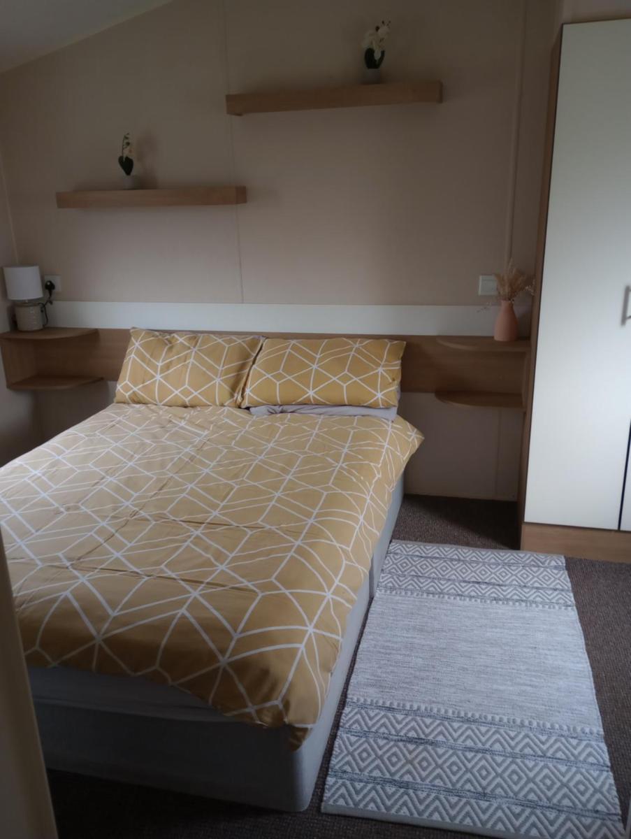 D24 is a 2 bedroom 6 berth caravan close to the beach on Whitehouse Leisure Park in Towyn near Rhyl with decking and private parking space This is a pet free caravan - Housity