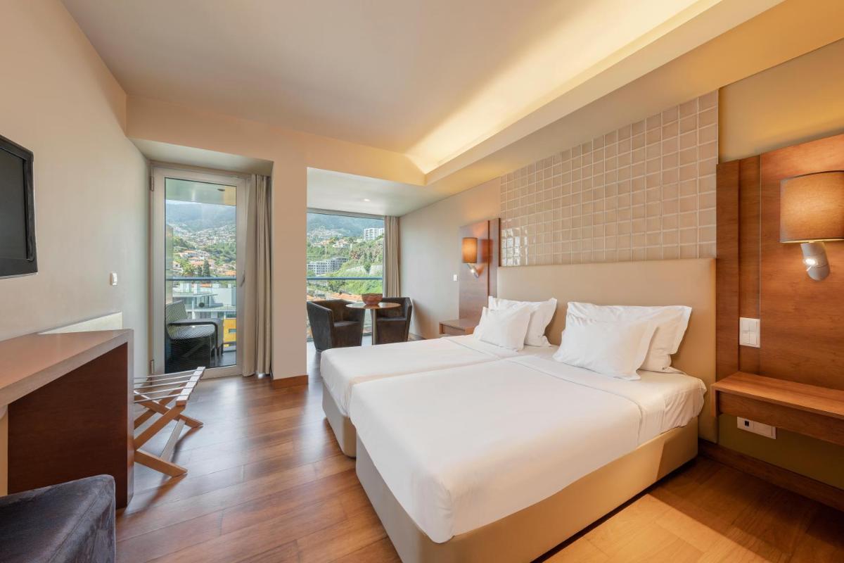 Uma cama ou camas num quarto em The Views Baia - Adults Only