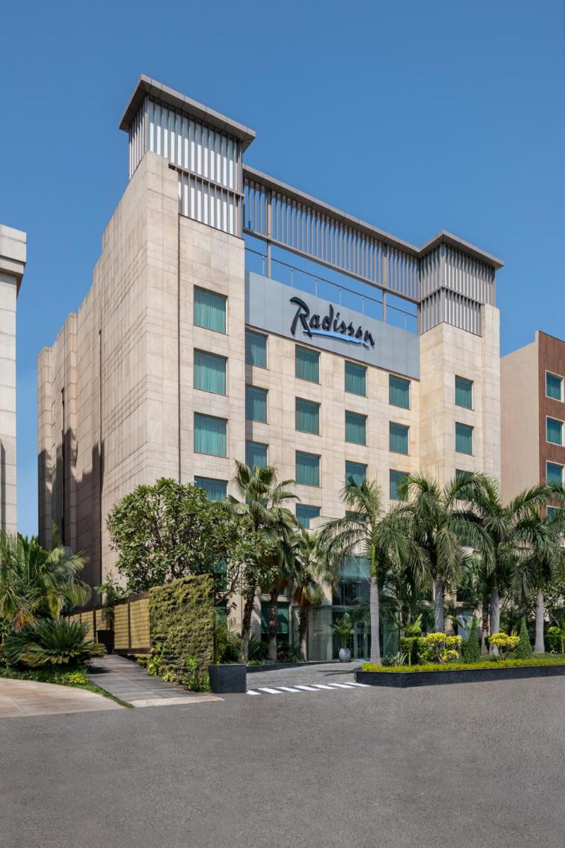 a hotel with a sign on the front of it at Radisson Hotel Sector 29 Gurugram in Gurgaon