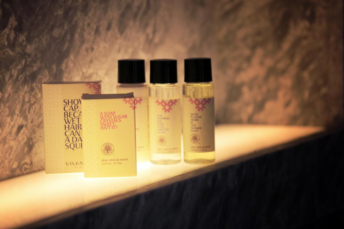 three bottles of skin care products sitting on a shelf at Vivanta New Delhi, Dwarka in New Delhi three bottles of skin care products sitting on a shelf at Vivanta New Delhi, Dwarka in New Delhi