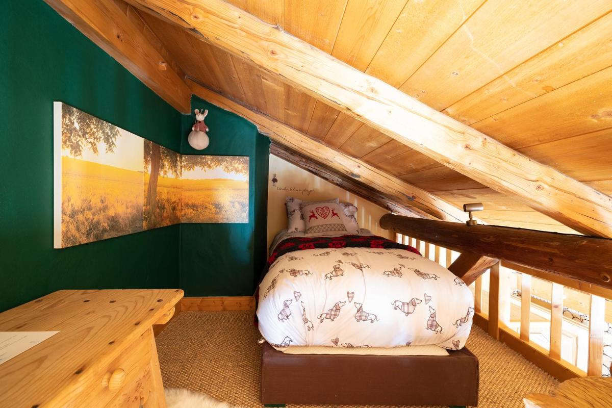 Un ou plusieurs lits dans un hébergement de l'établissement Magic Megève Bois