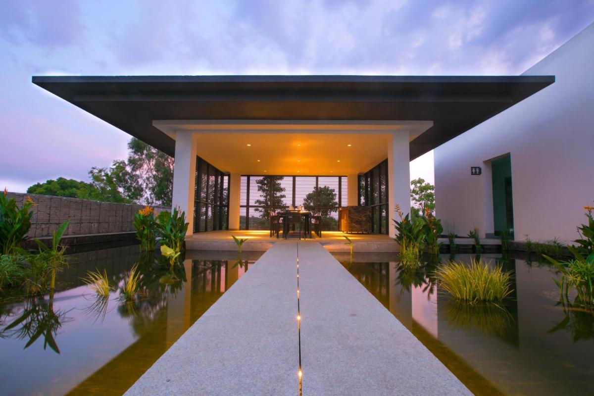 a villa with a pool and a house at BLVD Club - Near BENGALURU AIRPORT in Bengaluru +42 photos