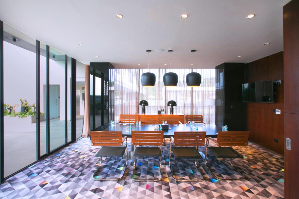 a dining room with a table and chairs at BLVD Club - Near BENGALURU AIRPORT in Bengaluru