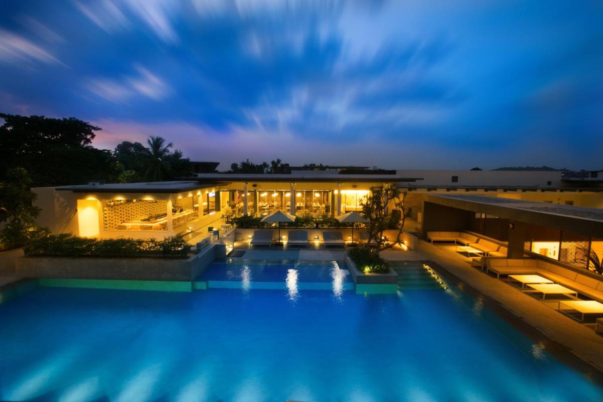 a view of a hotel pool at night at BLVD Club - Near BENGALURU AIRPORT in Bengaluru a view of a hotel pool at night at BLVD Club - Near BENGALURU AIRPORT in Bengaluru