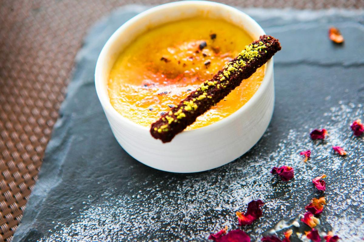 a bowl of soup with a stick in it at BLVD Club - Near BENGALURU AIRPORT in Bengaluru