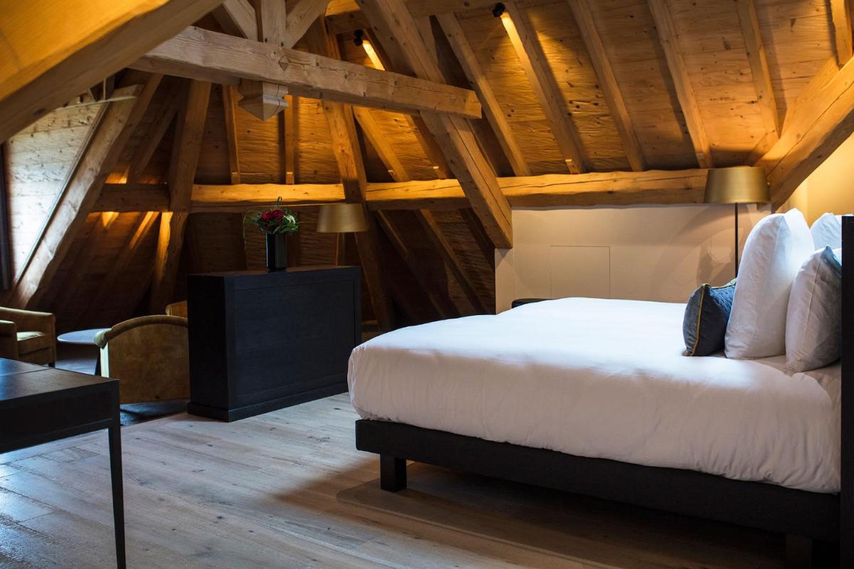 Un ou plusieurs lits dans un hébergement de l'établissement Hôtel L'Incomparable Aix-Les-Bains