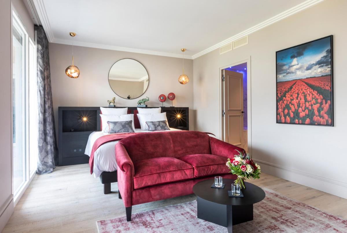 Un ou plusieurs lits dans un hébergement de l'établissement Hôtel L'Incomparable Aix-Les-Bains