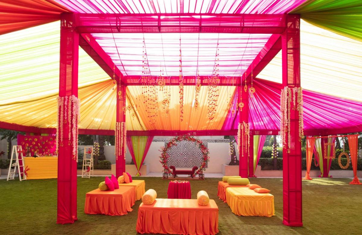 a tent with a table and chairs in it at Hyatt Regency Amritsar Hotel & Spa in Amritsar