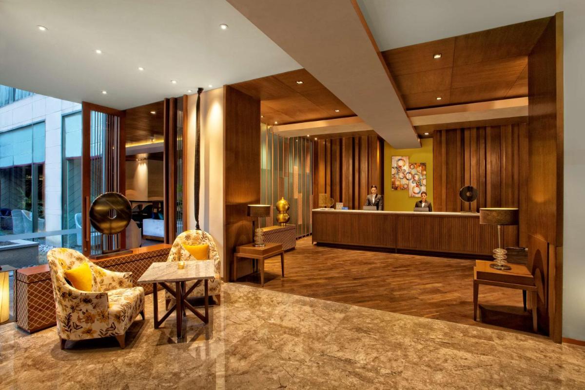 a lobby of a hotel with a waiting room at Hyatt Regency Amritsar Hotel & Spa in Amritsar