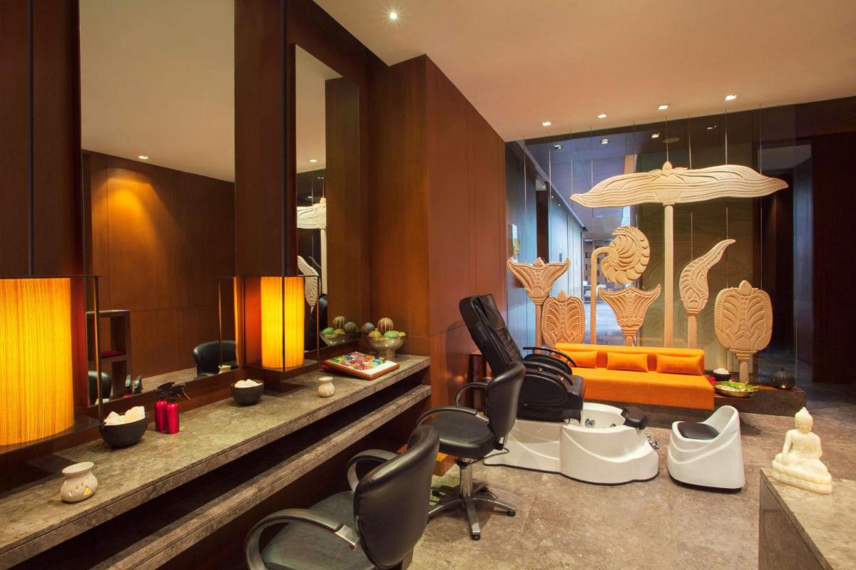 a living room with some chairs and a couch at Hyatt Regency Amritsar Hotel & Spa in Amritsar