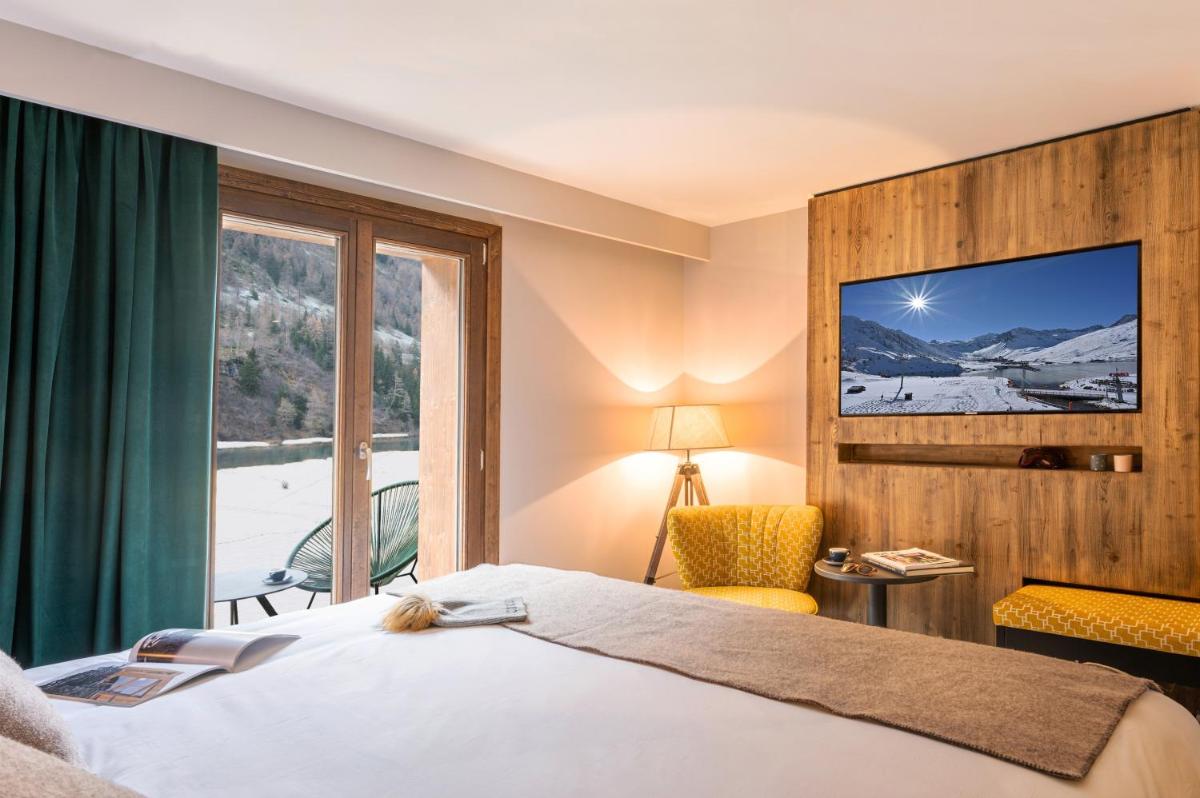 Un ou plusieurs lits dans un hébergement de l'établissement Hotel Tetras Lodge